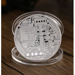 Moneda Bitcoin, color plata, en caja