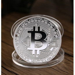 Moneda Bitcoin, color plata, en caja